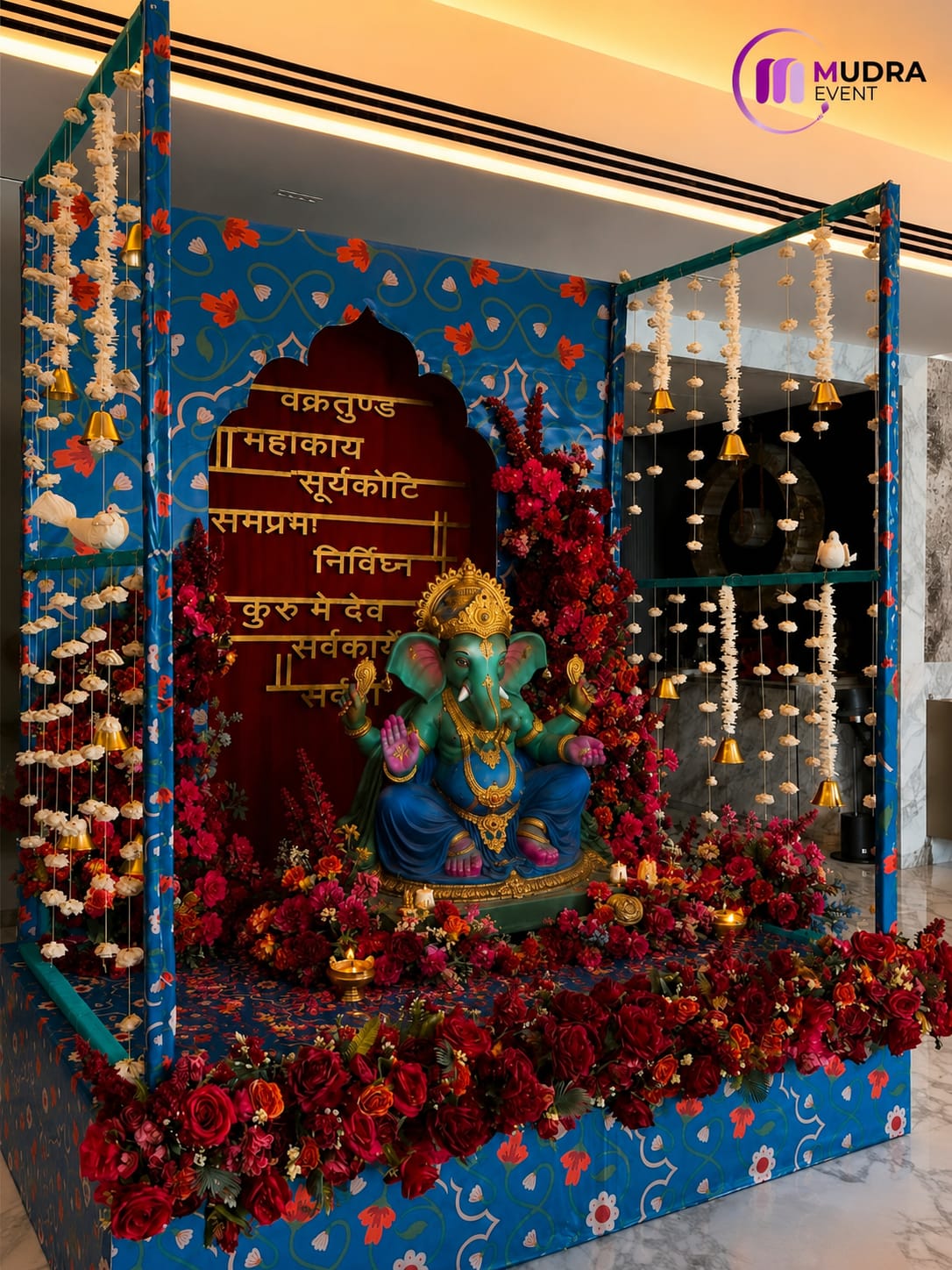 Royal Blue Floral Frame Ganpati Decoration with Sanskrit Backdrop