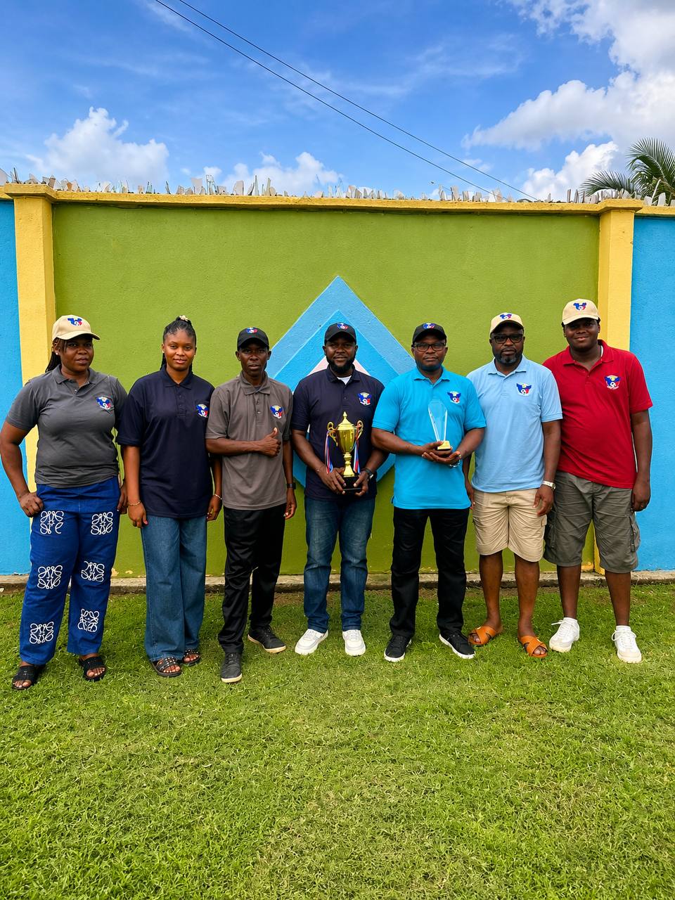 Members of the staff with the trophy
