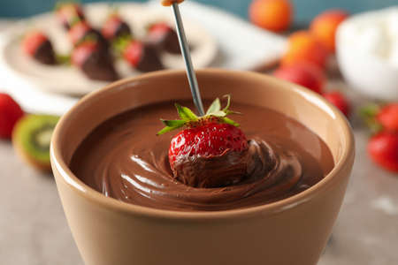 Strawberry in chocolate, close up. chocolate fondue