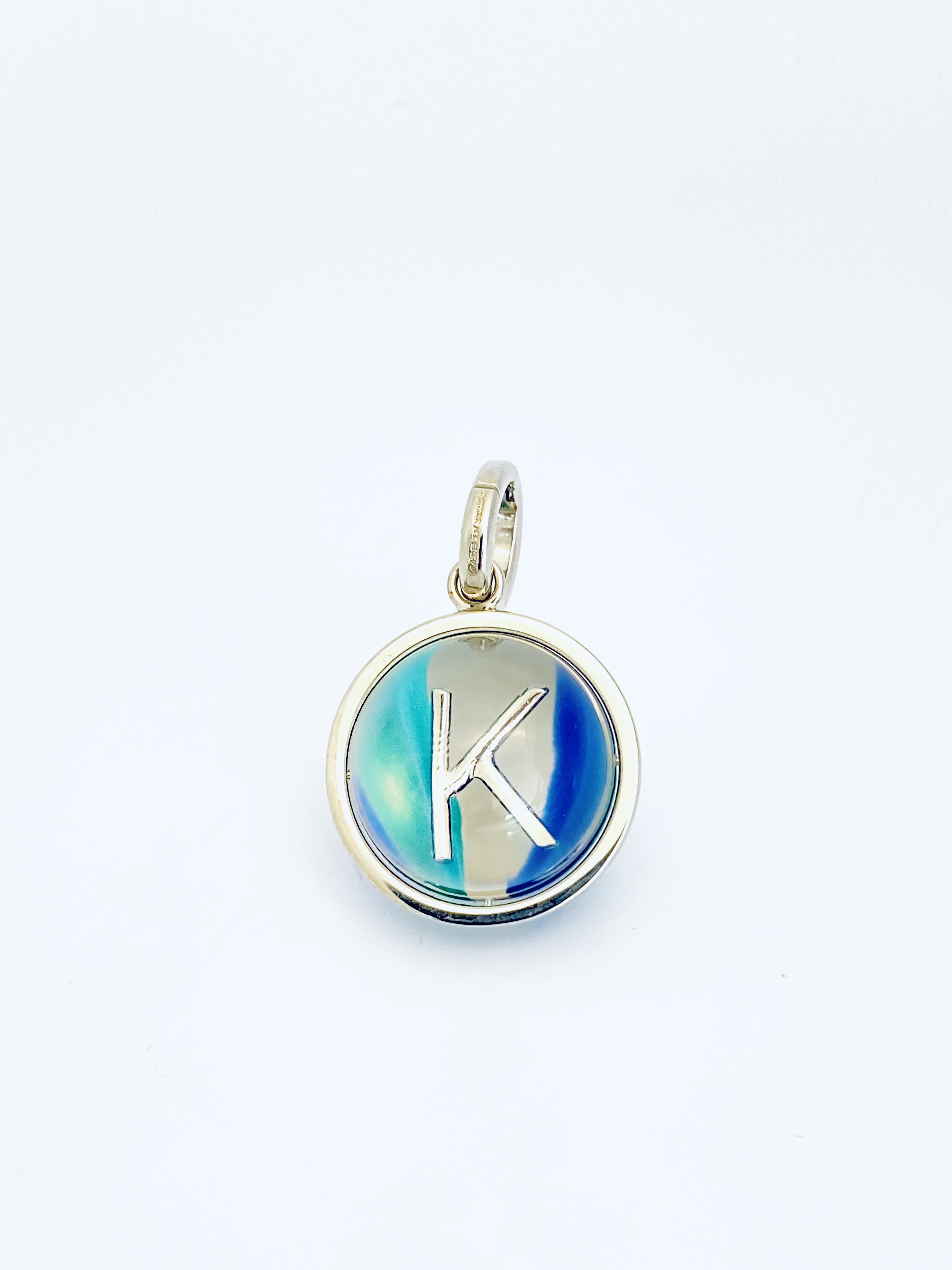 Click to view more detailed imagery on our partner's website Burberry Marbled Resin 'k' Alphabet Charm In Palladium/ocean Blue In Multi