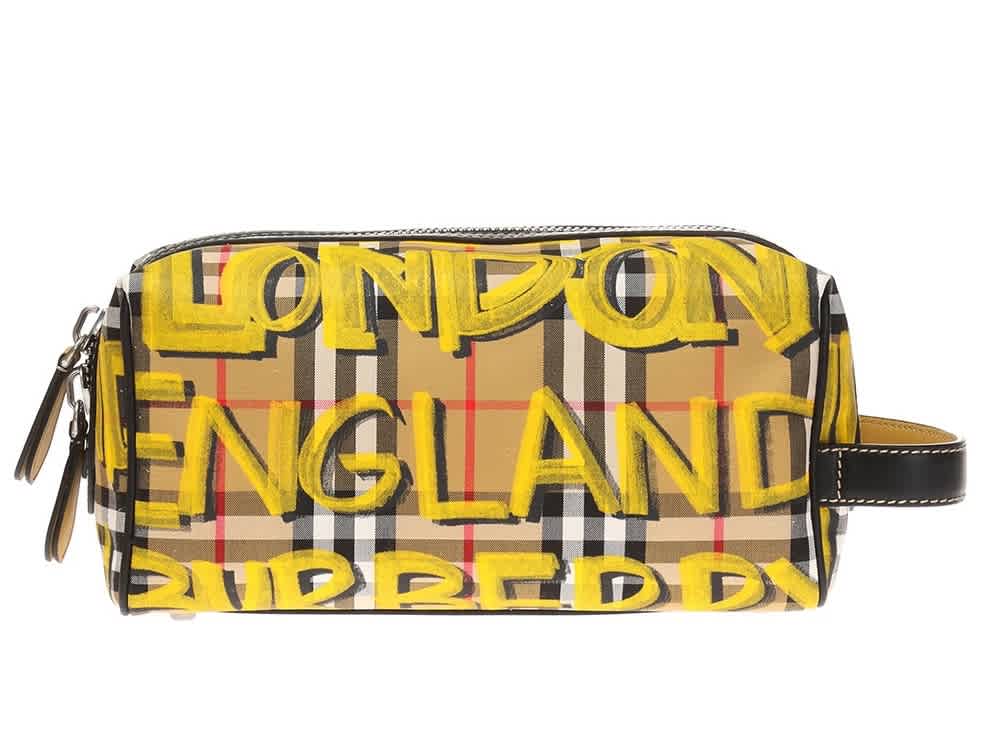 Click to view more detailed imagery on our partner's website Burberry Graffiti Print Checked Wash Bag In Yellow