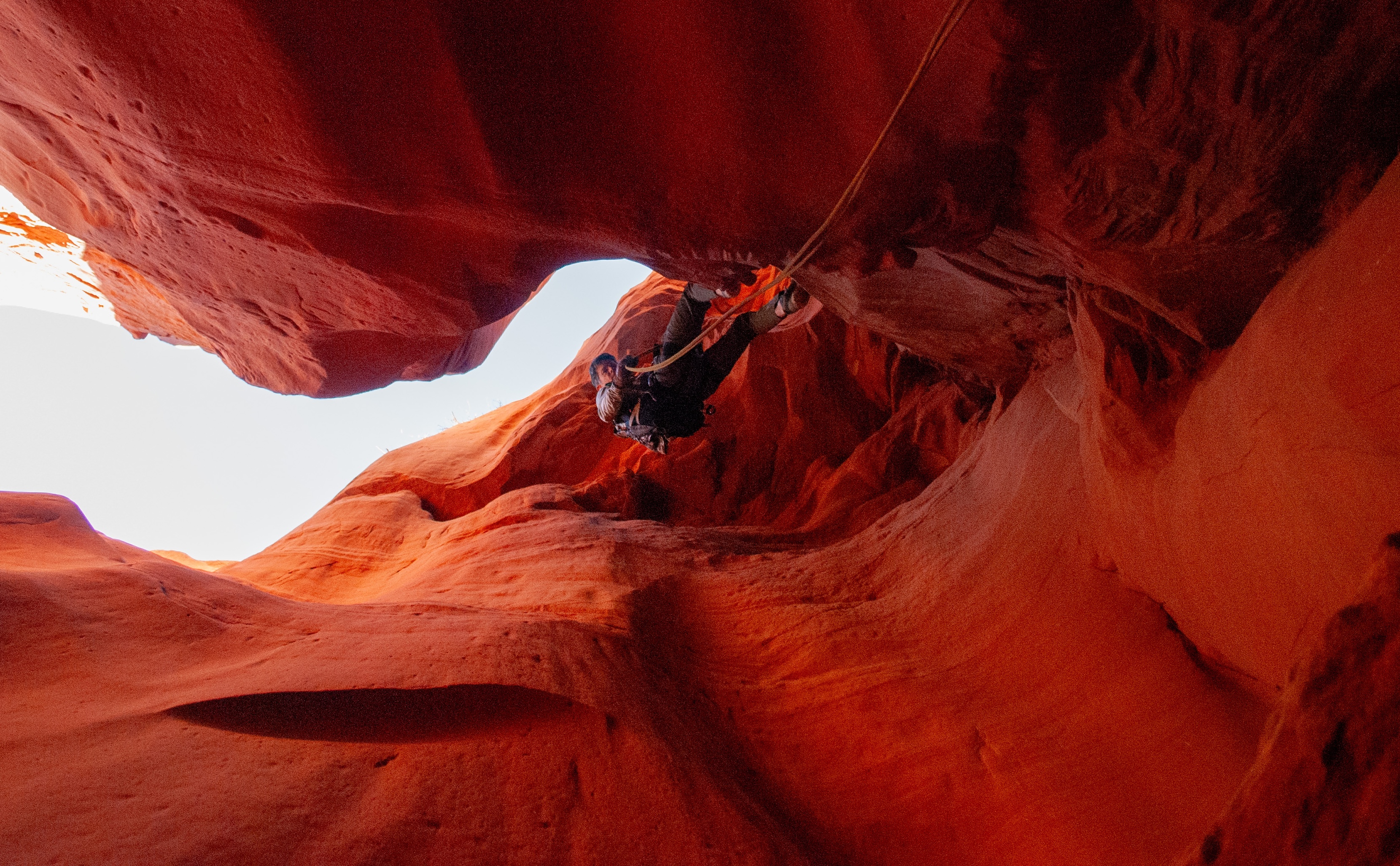 Narrow 70ft rappel in Little Blue John Canyon