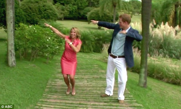 Got the moves: Prince Harry shows Couric the move he picked up from Olympic champion Usain Bolt during his tour of the Caribbean to celebrate the Queen's diamond jubilee