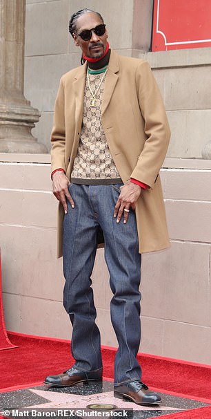 Drop it like it's hot: He had baggie blue jeans on underneath as well as a freshly polished pair of black and brown wingtips