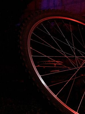 11pm, outside,bike,object, black,red,purple