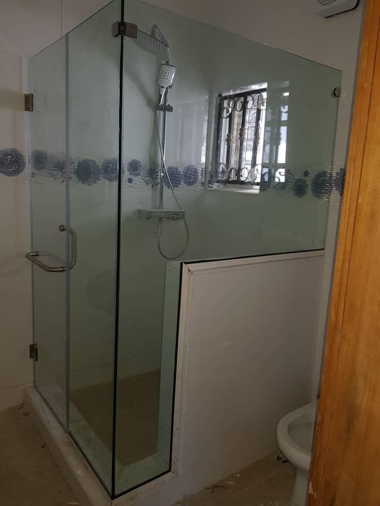 Frameless L-Shaped Shower Enclosure with Privacy Etching