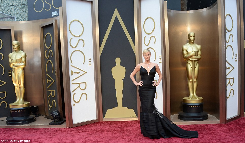 Back to black: Charlize Theron looked dramatic in her black fishtail gown with diamond jewels