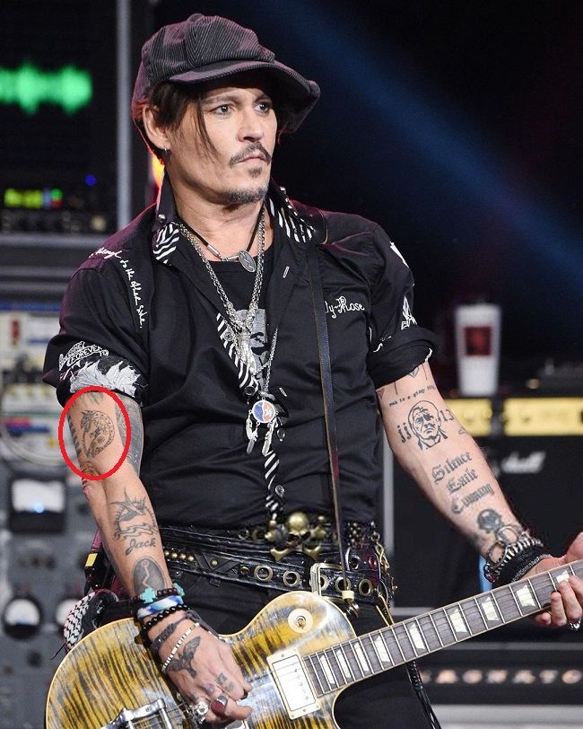 johnny depp-ouroboros tattoo