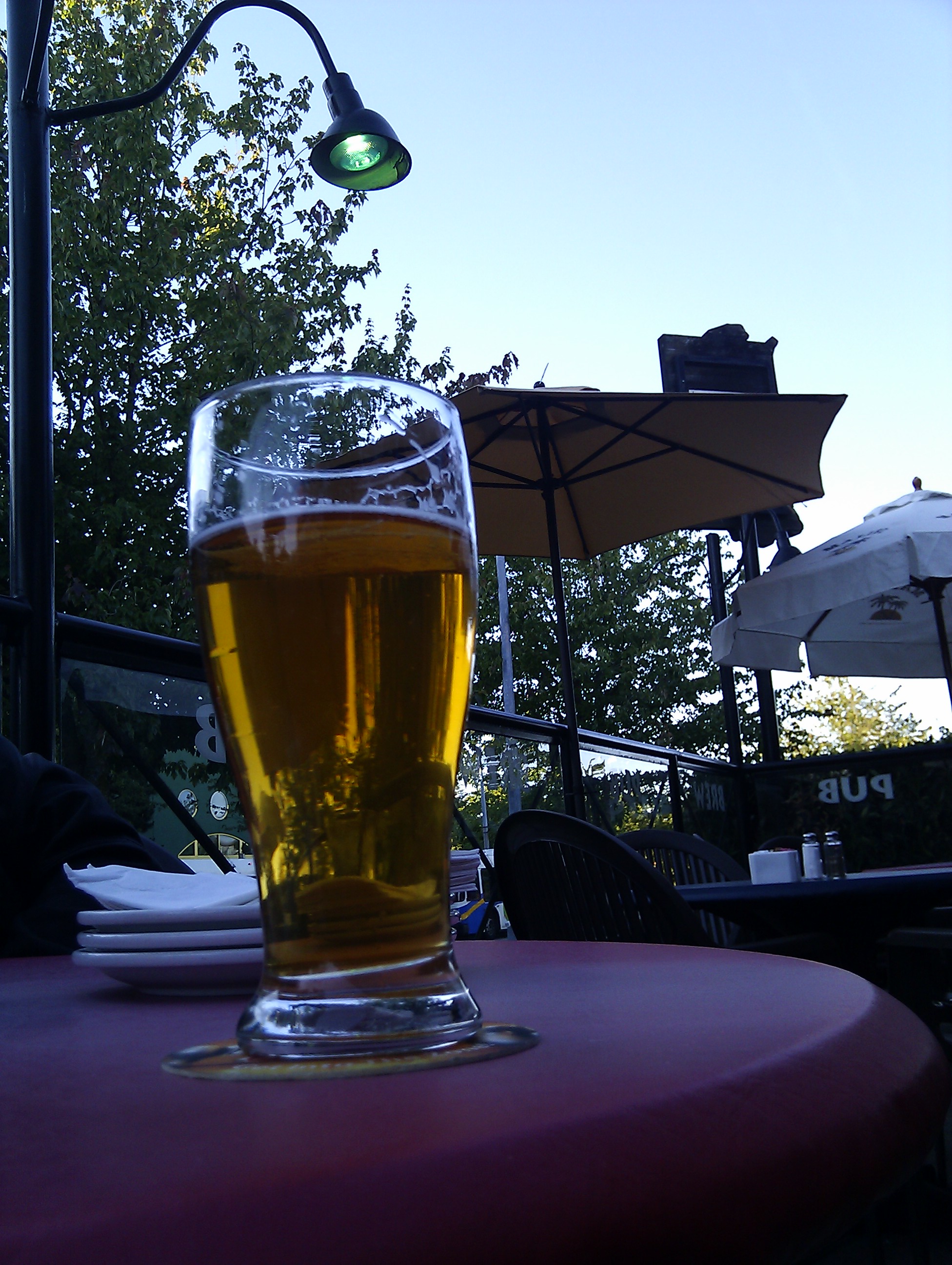 Chilling on a patio with a beer before our flight back home :(