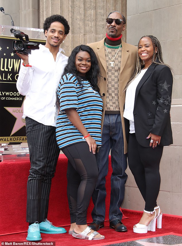 Doggfather: Snoop's loving family was also there to celebrate the big day