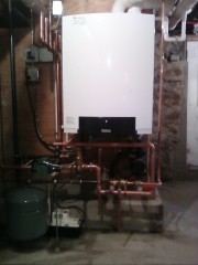 Affordable Heating and Air Conditioning - Tankless water heater professionally installed at a home