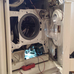 Hudson Appliance Repair & Removal - Working on a broken appliance