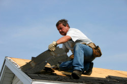 William Arsenault Contracting, LLC - Roofing contractor pulling up old shingles