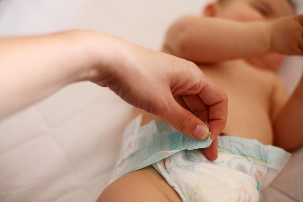 A mother checking diaper