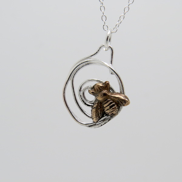 Tiny bee necklace.