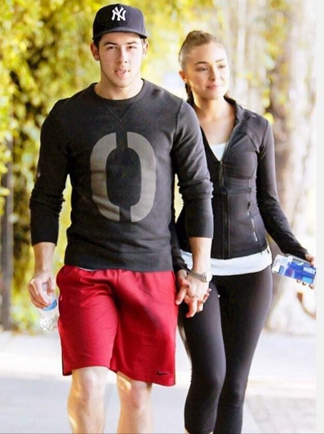 Jonas walking with Olivia and dick bulge in red shorts