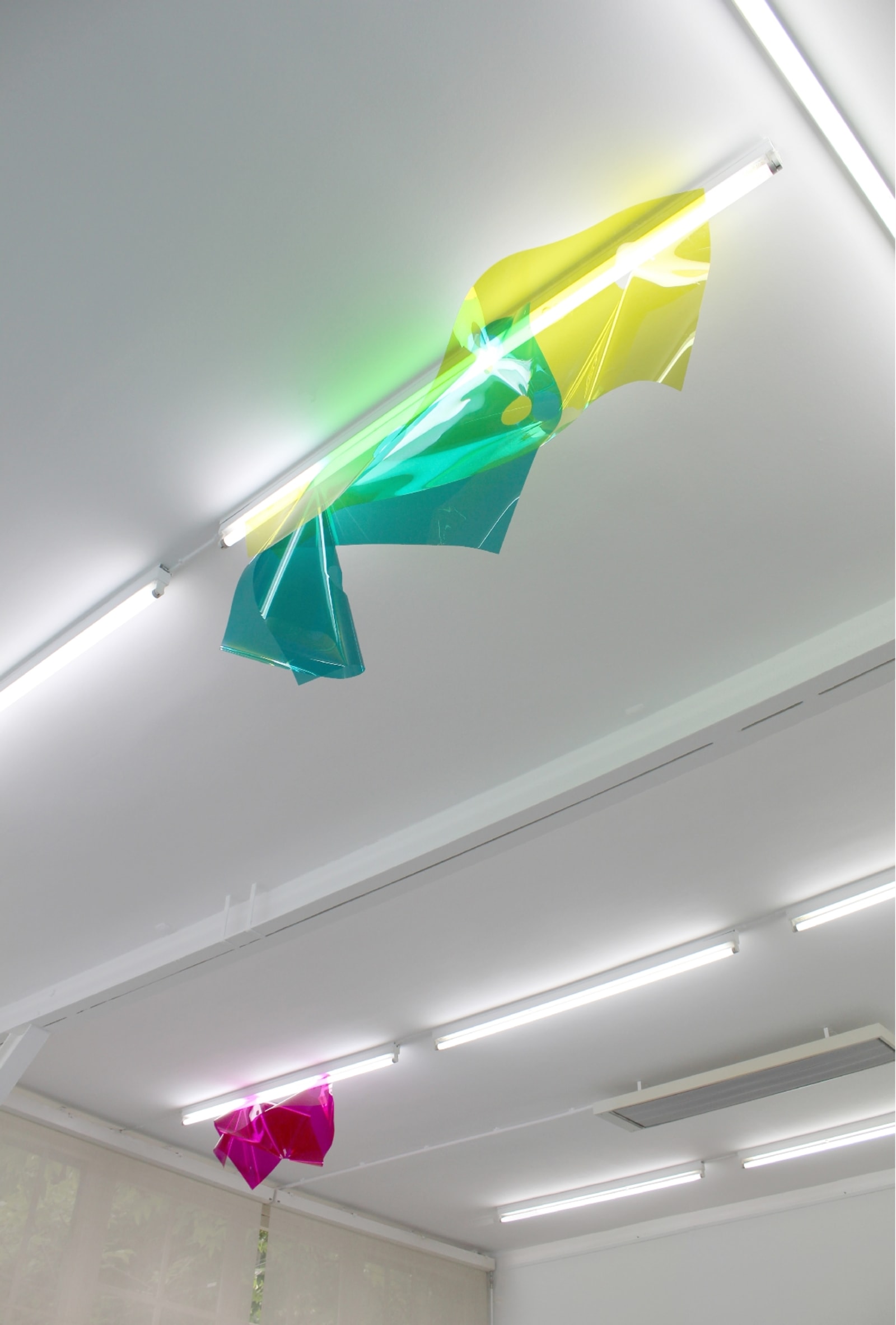diffraction - three light filters suspended to two neon lights in a white space - light filters, neon lights - paul lahana
