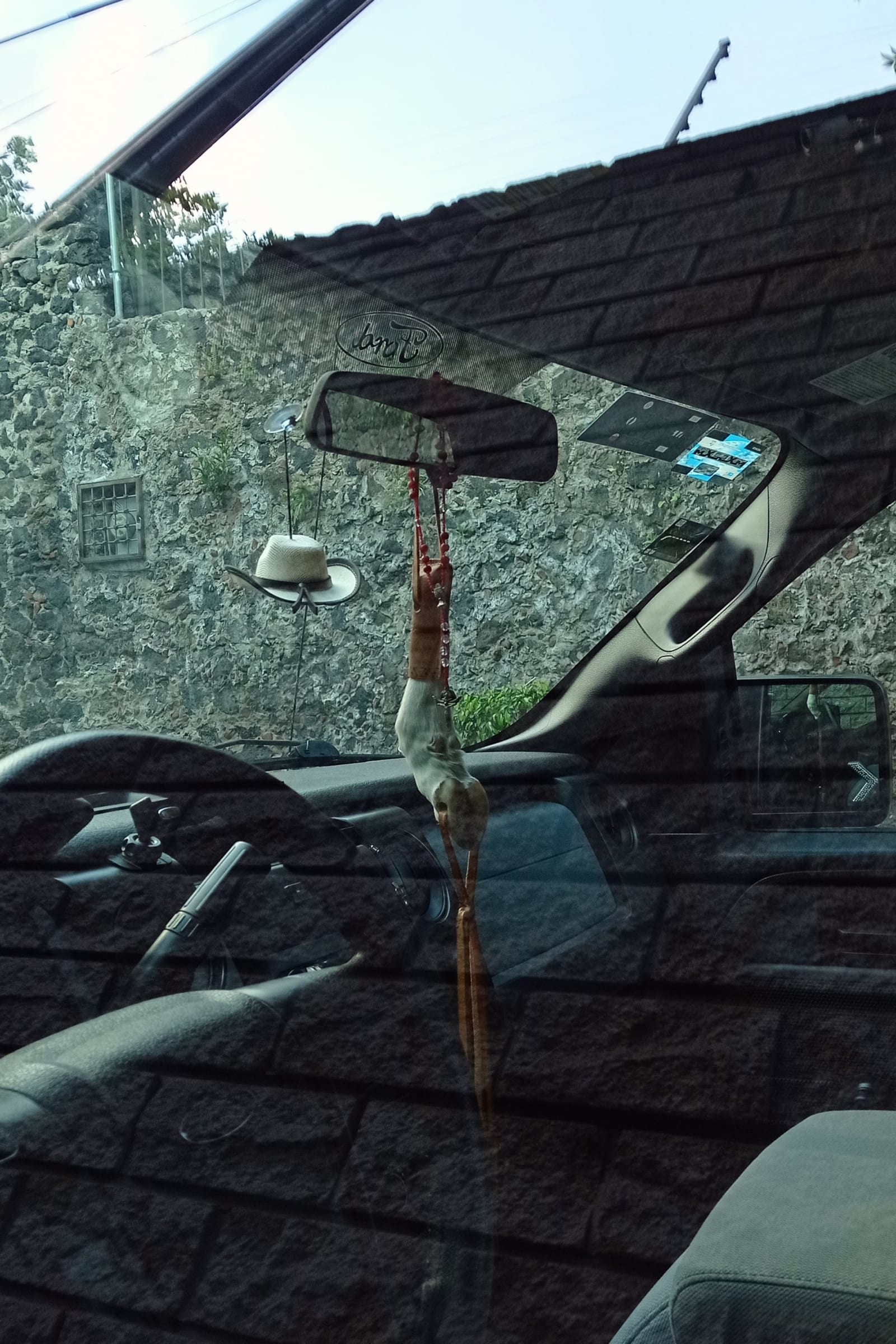 a very lucky man - two amulets are suspended in a Ford 4x4 - amulets (2), Ford 4x4 - paul lahana