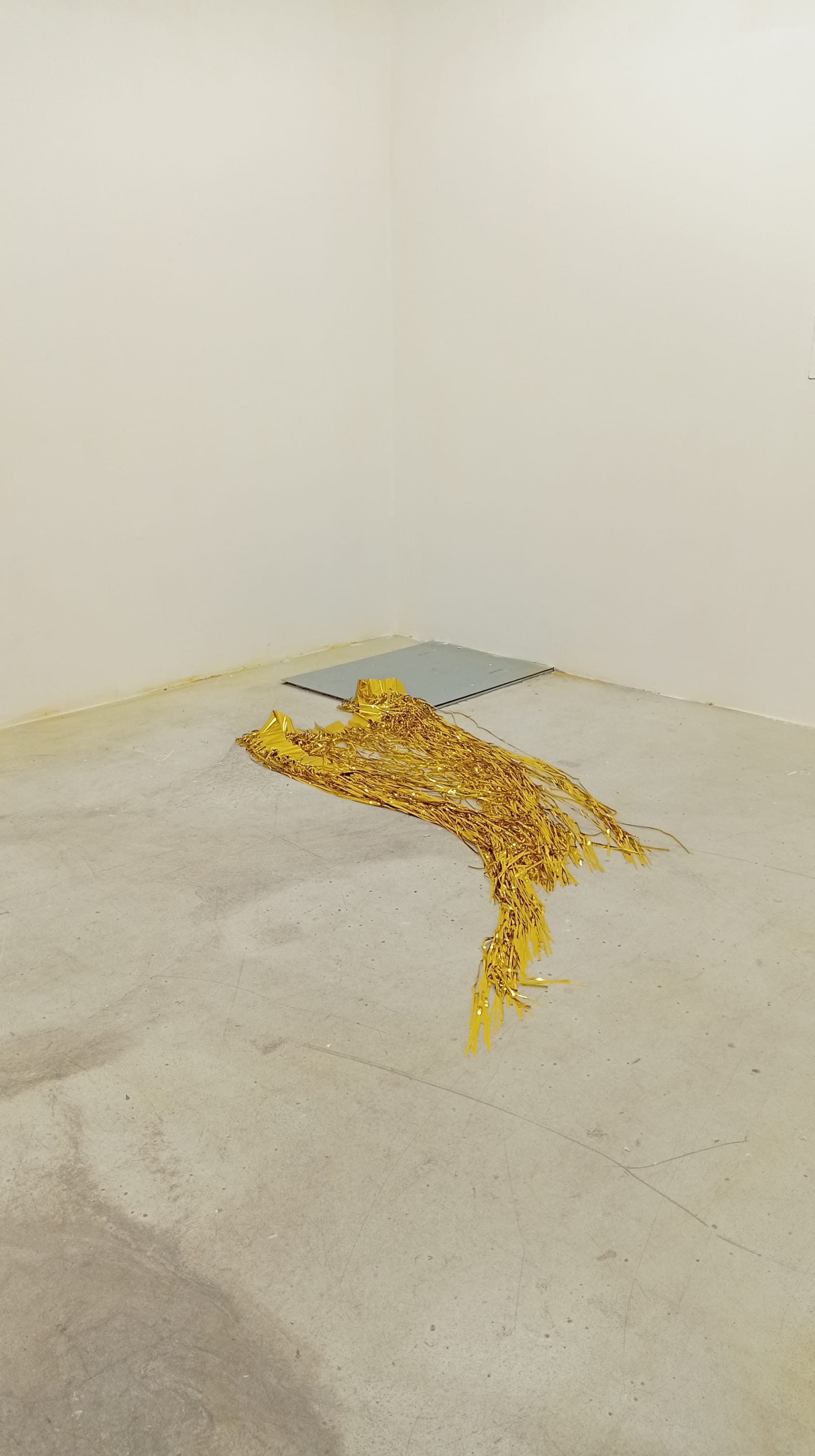 good old times - A gold plastic curtain is thrown on a concrete ground - gold curtain, concrete - paul lahana