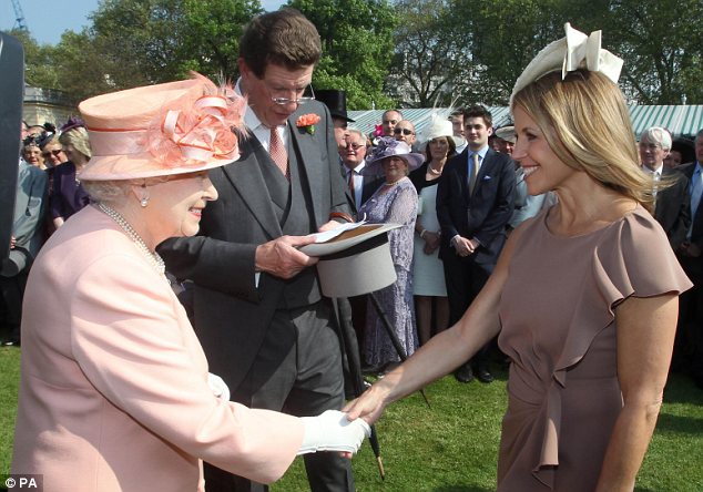 All smiles: The Queen met U.S. television anchor Katie Couric at the Buckingham Palace garden party today