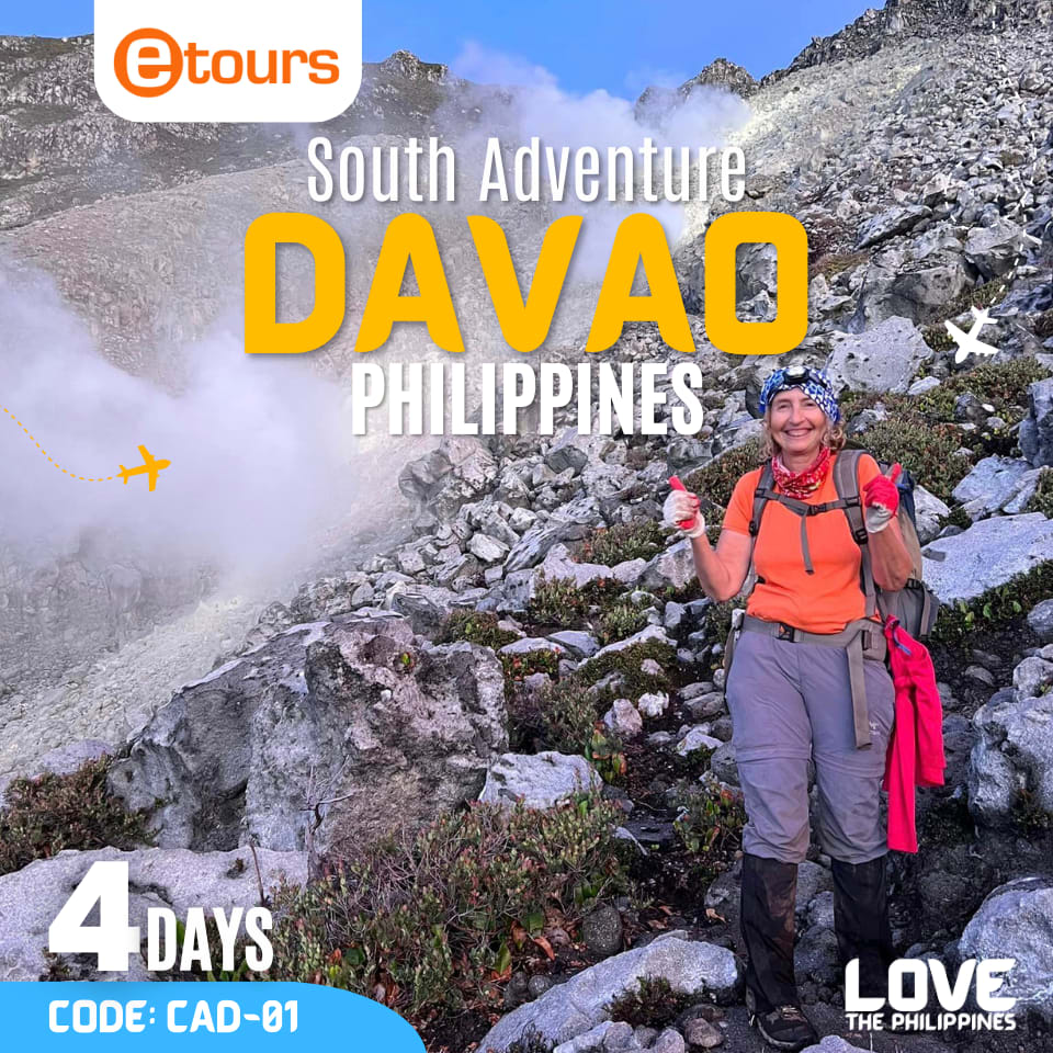 A woman hiker smiling and giving a thumbs up in front of the majestic Mount Apo. 