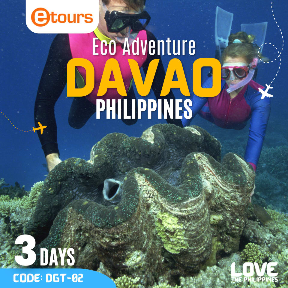 A couple snorkeling amidst vibrant coral reefs and giant clams in the crystal-clear waters of Davao.  
