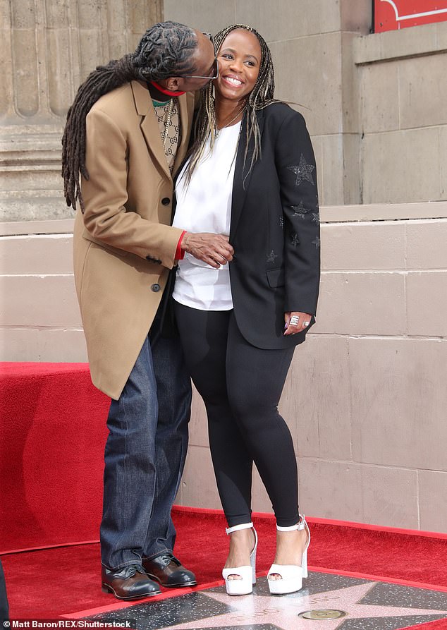 In it for the long haul: Snoop Dogg kisses his wife of 21 years Shante Taylor as he gets a star on Hollywood Walk of Fame in Los Angeles on Monday