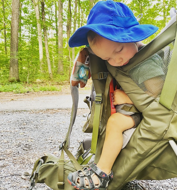 One year old catching a nap in the Kelty Journey Perfectfit hiking backpack