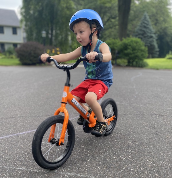 My son on his 14x Strider Pedal Bike