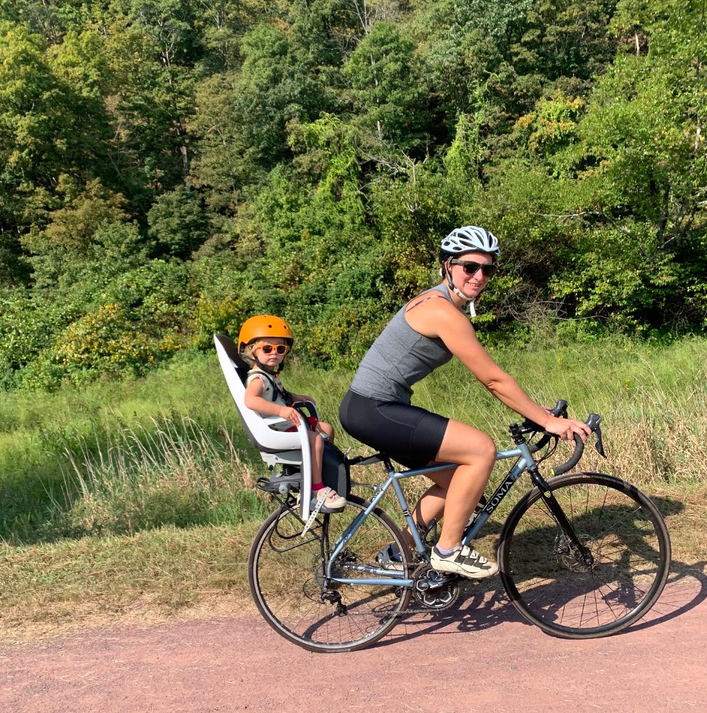 mom and toddler riding together on one bike with bike seat in bucks county pa