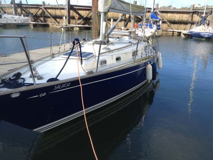Before A Washdown - Just Some Faded Grey Teak and Untidy Gelcoat Make a Boat Look Used and Old