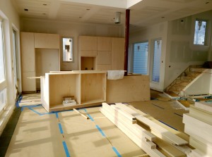 The cabinets are being installed and stair parts are waiting.