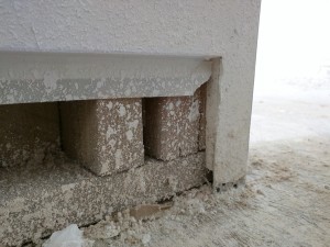 A Z-reveal drywall trim was used to terminate the drywall before the baseboard trim. Outside corners, including the EZY-Jamb were filled with mud.