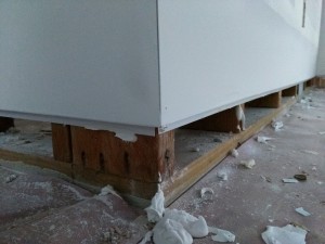 Outside corner flush base detail before baseboard installation.