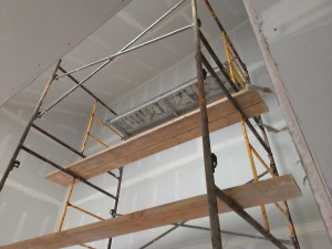 Stilts (quite an amazing sight) aren't enough to reach the top of the stair tower so scaffolding was needed.