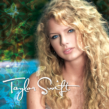 A portrait of Swift in wavy blonde hair against a blue-and-green background