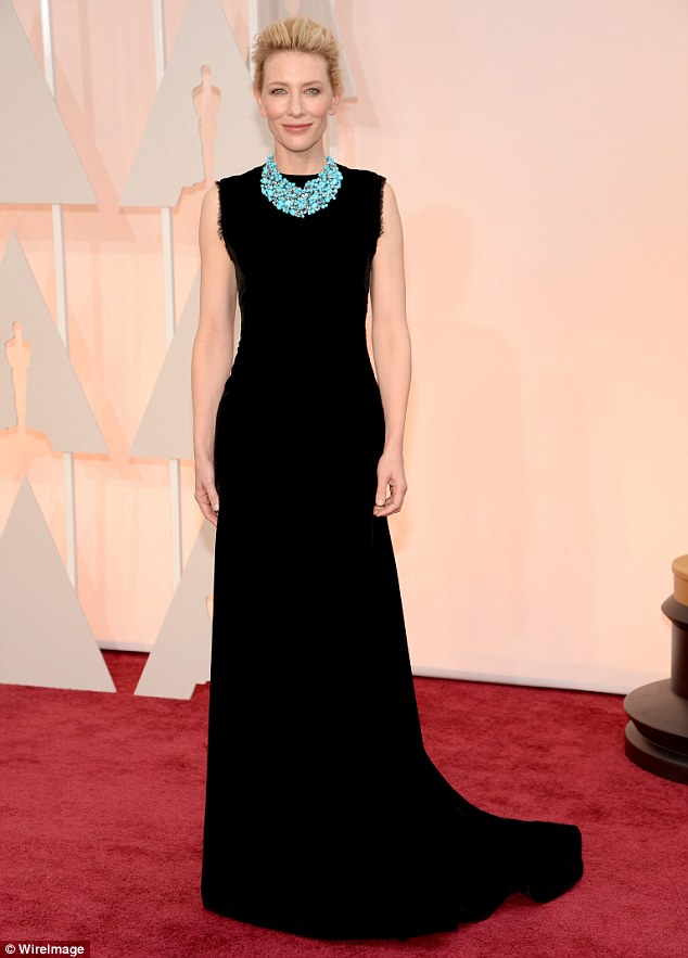 Statuesque: Cate Blanchett stuns in a long black sophisticated John Galliano for Maison Margiela dress which she teamed with a statement Tiffany And Co. turquoise necklace