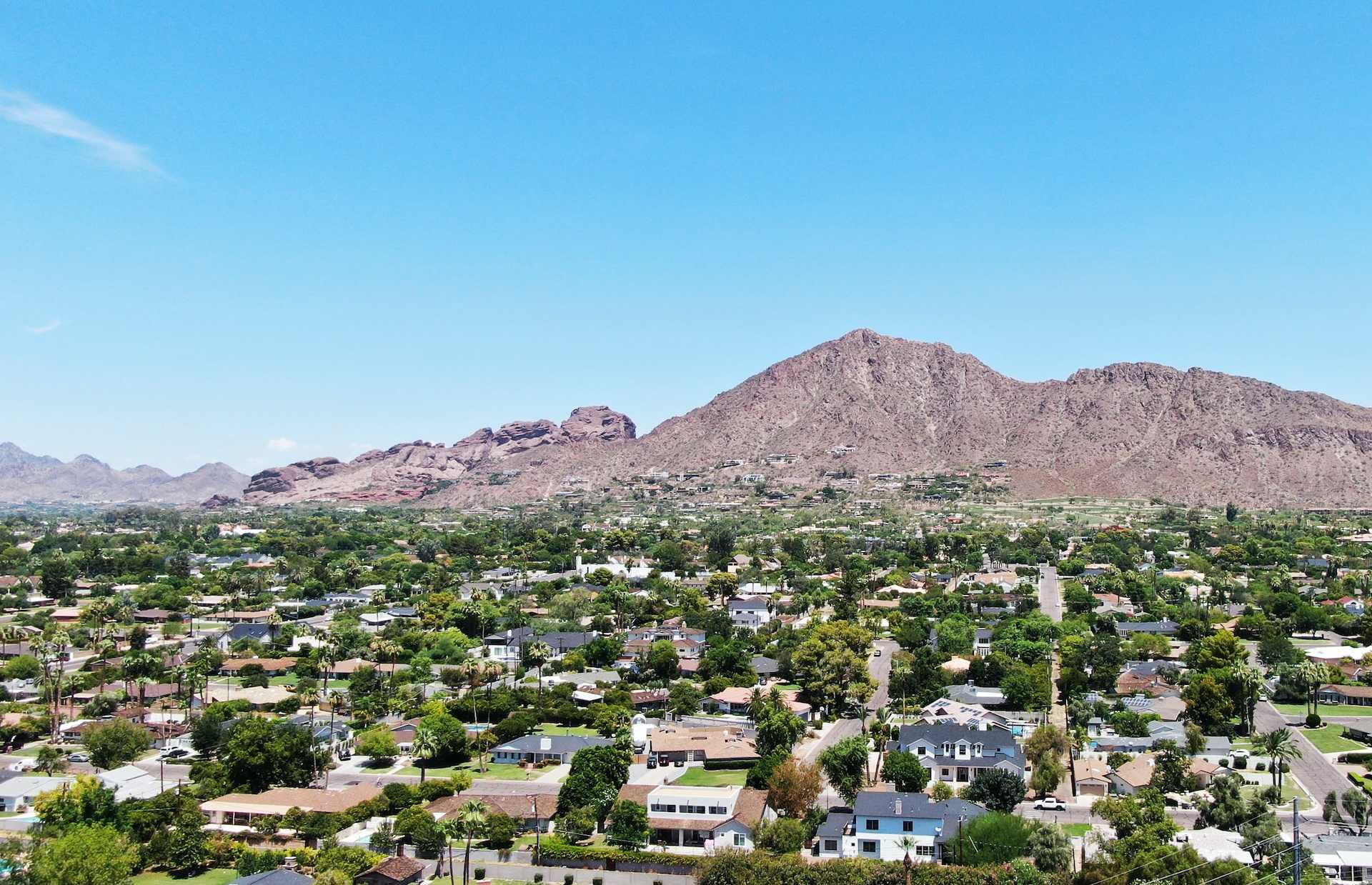 Camelback Mountain rises over the downtown Phoenix cityscape near Del Webb's new homes in Phoenix, Arizona