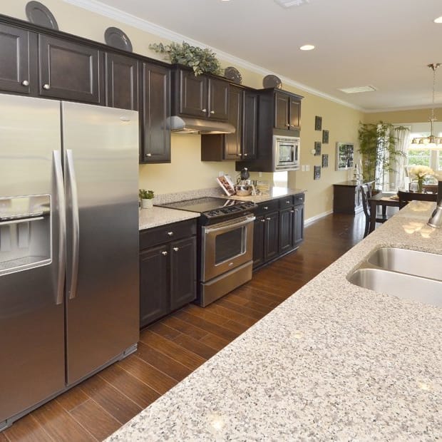 Included Features 2016 Package with granite countertops in kitchen