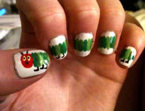 Nail art inspired by the children's book The Very Hungry Caterpillar.