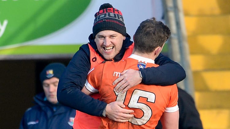 Paddy McKeever and Ethan Rafferty celebrate at the Athletic Grounds.