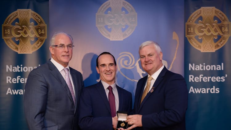 David Coldrick, Meath, is presented with his All-Ireland Medal by Uachtarán Chumann Lúthchleas Aogán Ó Fearghail and Seán Walsh, Chairman of National Referee Development Committee, at the GAA National Referees Awards Banquet.