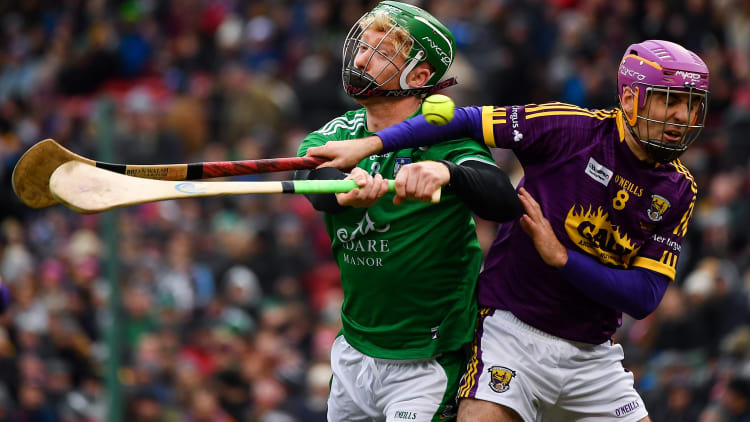 Cian Lynch of Limerick in action against Shaun Murphy of Wexford during the Aer Lingus Fenway Hurling Classic 2018 semi-final.