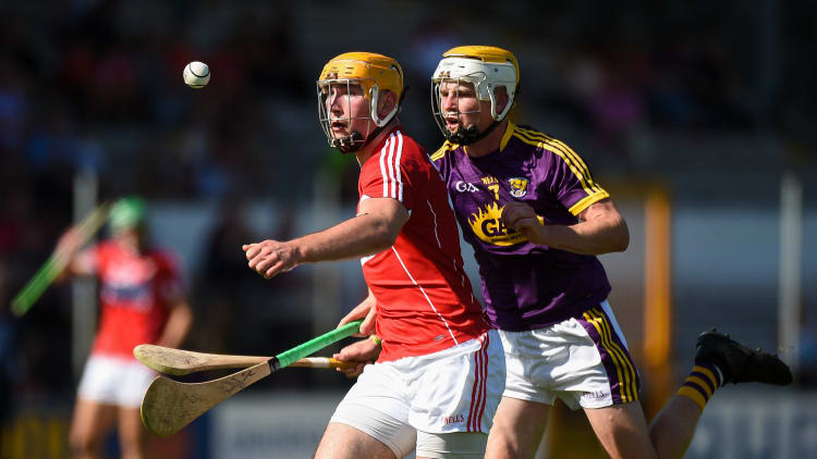 Declan Dalton, Cork, and Ian Carthy, Wexford, during the Bord Gais Energy All Ireland Under 21 semi-final at Nowlan Park.