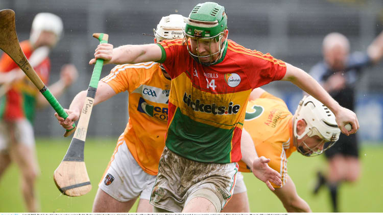 Paul Coady, Carlow, in action against Paddy Burke and Stephen Rooney, Antrim, in the Allianz Hurling League Division 2A Final in April.