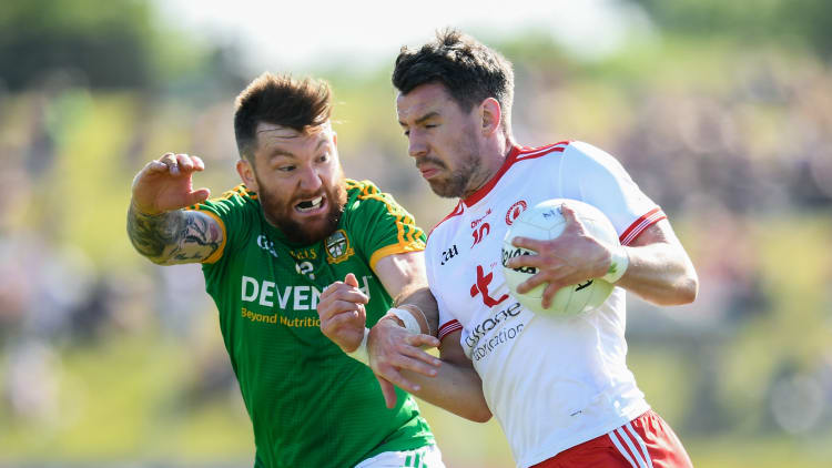 Mickey Burke, Meath, and Mattie Donnelly, Tyrone, in action at Pairc Tailteann, Navan.