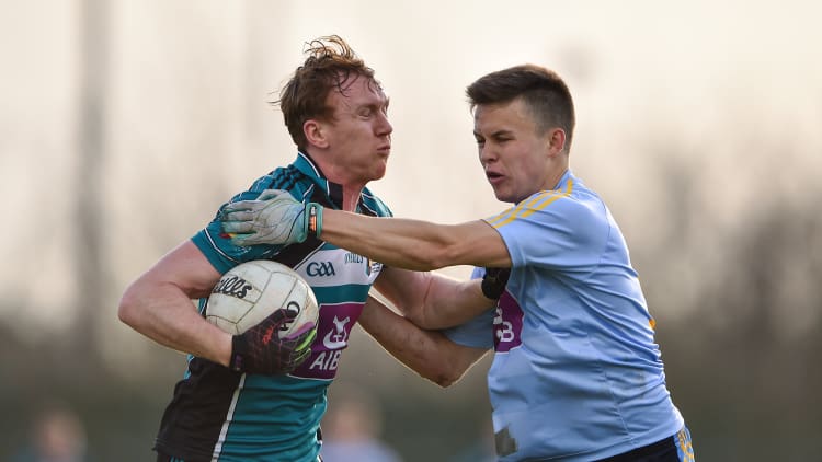 Paul Cribbin, NUI Maynooth, and Eoin Murchan, UCD, in Electric Ireland Sigerson Cup action.