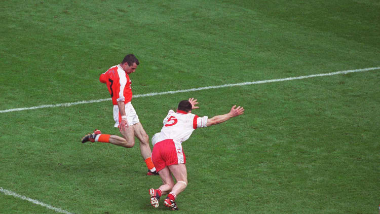 Conor Gormley blocks a Steven McDonnell attempt in the 2003 All Ireland SFC Final.