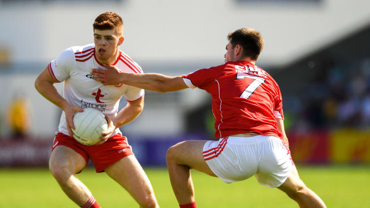 Cathal McShane, Tyrone, and Cian Kiely, Cork, during the All Ireland SFC Round Four Qualifier clash at O'Moore Park.