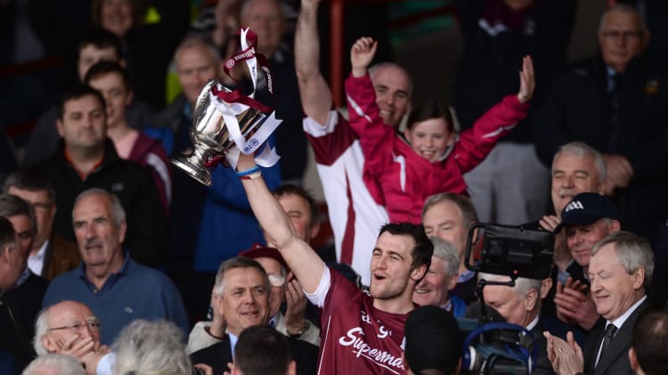 David Burke raises the Allianz Hurling League trophy.